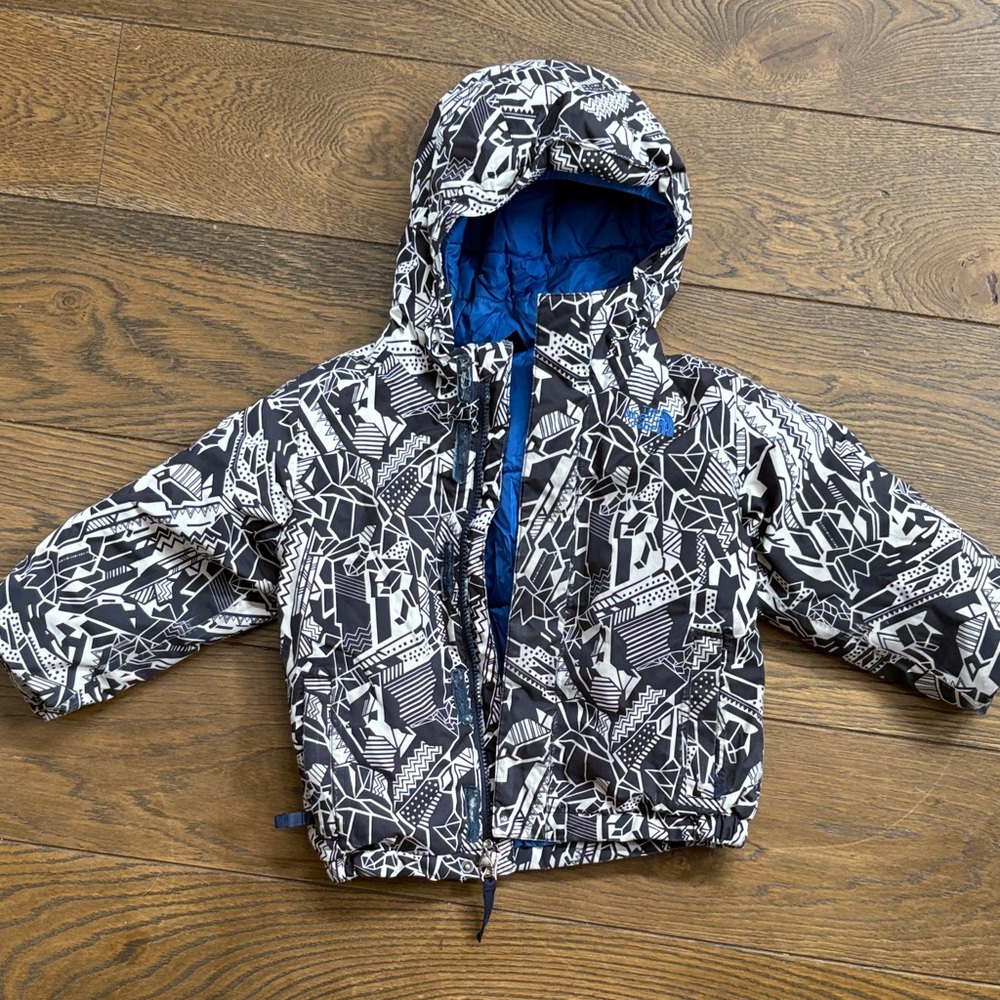 The North Face Black and White Patterned Hooded Jacket with Blue Lining